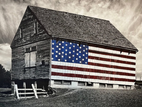 old barn with flag on side